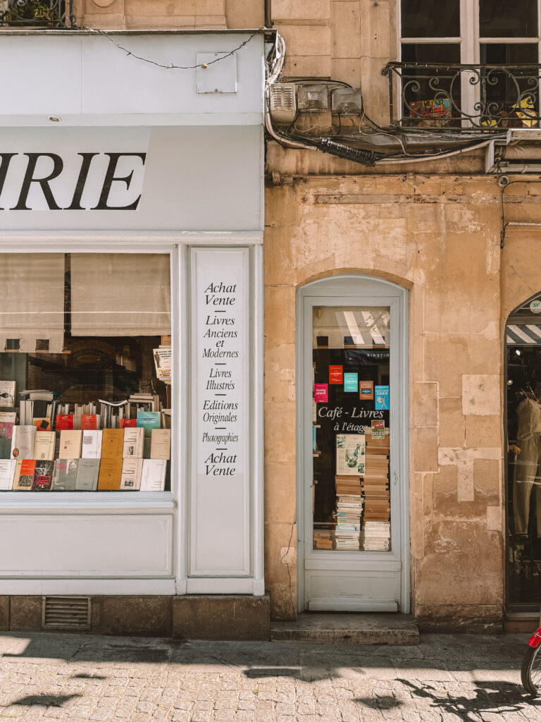 Browsing books inside an independent bookshop in Caen France