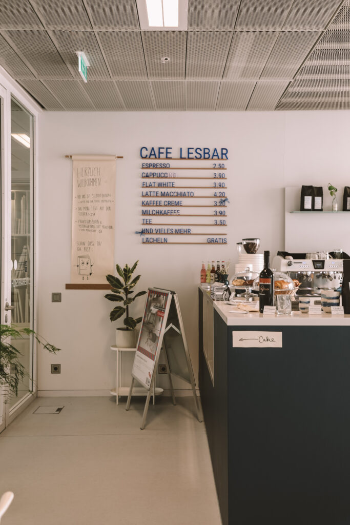 Café Lesbar inside the Stuttgart Public Library with coffee and modern seating area