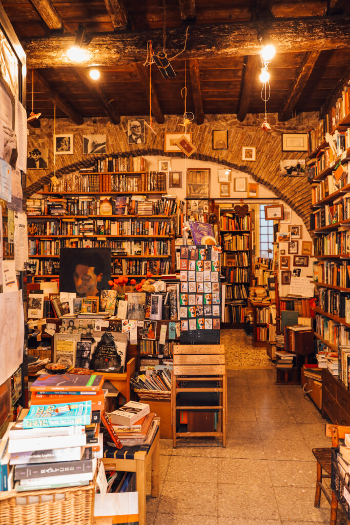 Independent bookshop interior at Open Door Bookshop in Rome