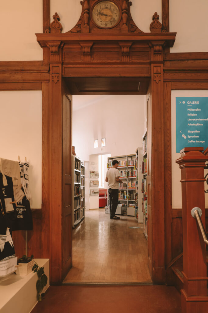 people reading and studying in a public library