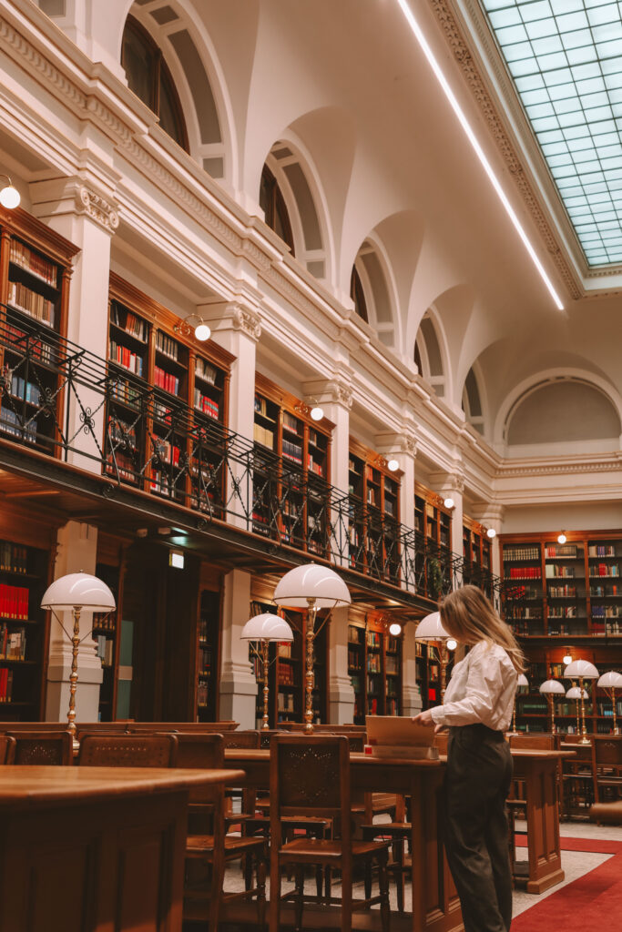 people spending time reading and browsing at the university library of Graz
