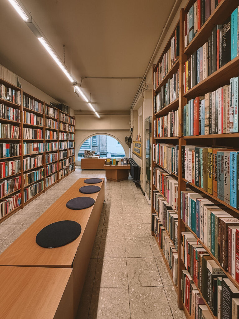 Packed bookshelves inside De Slegte Ghent