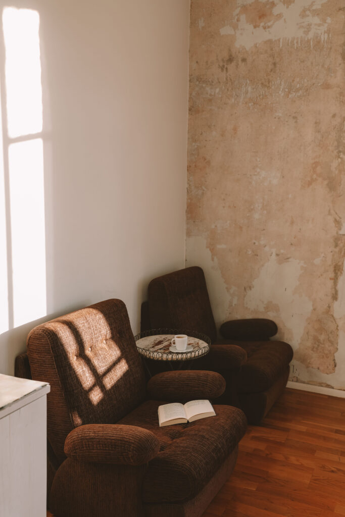 open novel and coffee cup in a cozy café setting