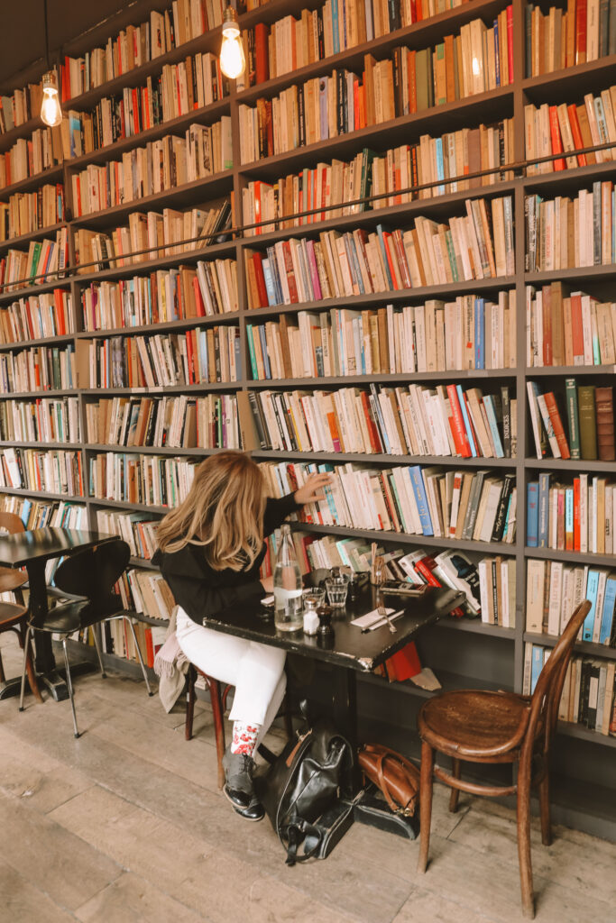 reader enjoying a book in a calm café atmosphere