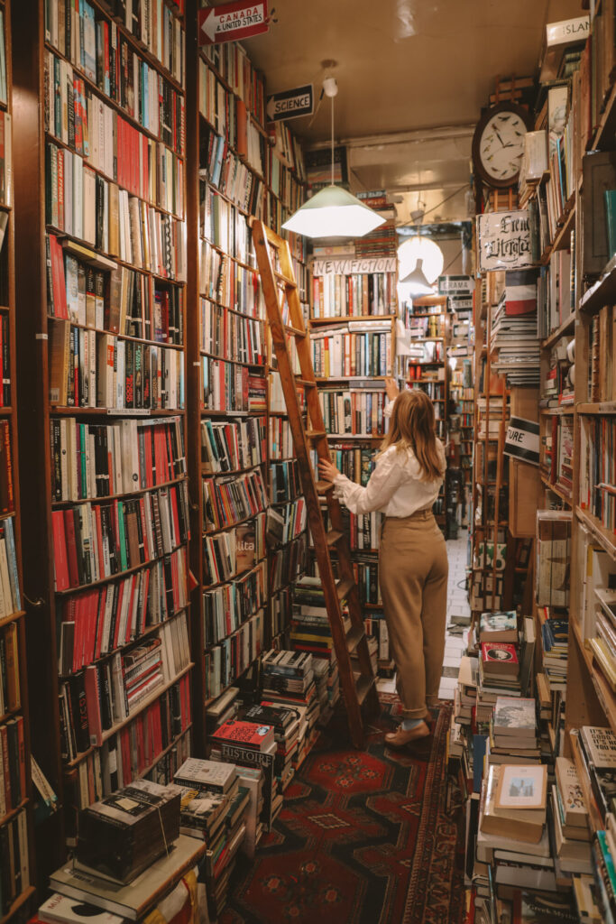 the abbey bookstore in Paris with wooden shelves up to the ceiling