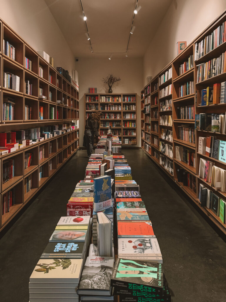 Large book selection inside Paard van Troje in Ghent