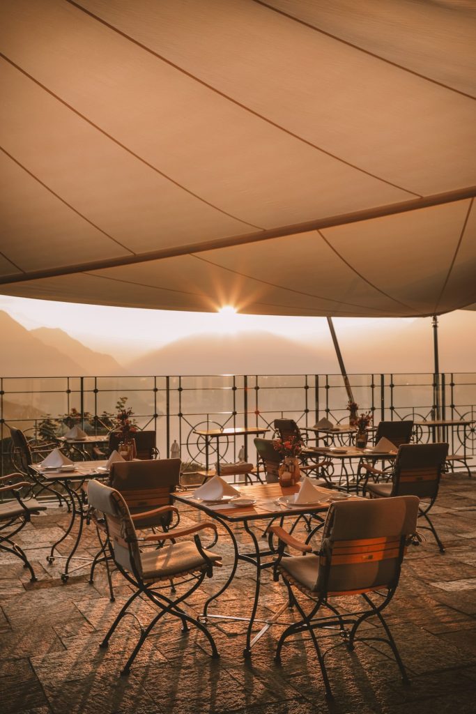 Hotel breakfast at sunrise with panoramic mountain views