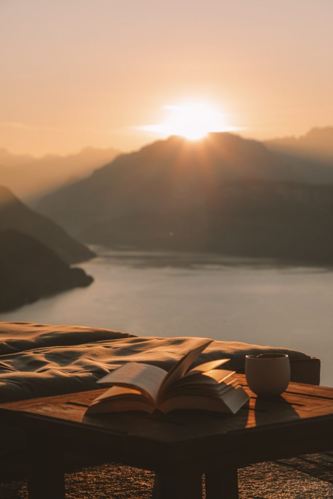 Reading a book with a panoramic view over Lake Lucerne in Switzerland