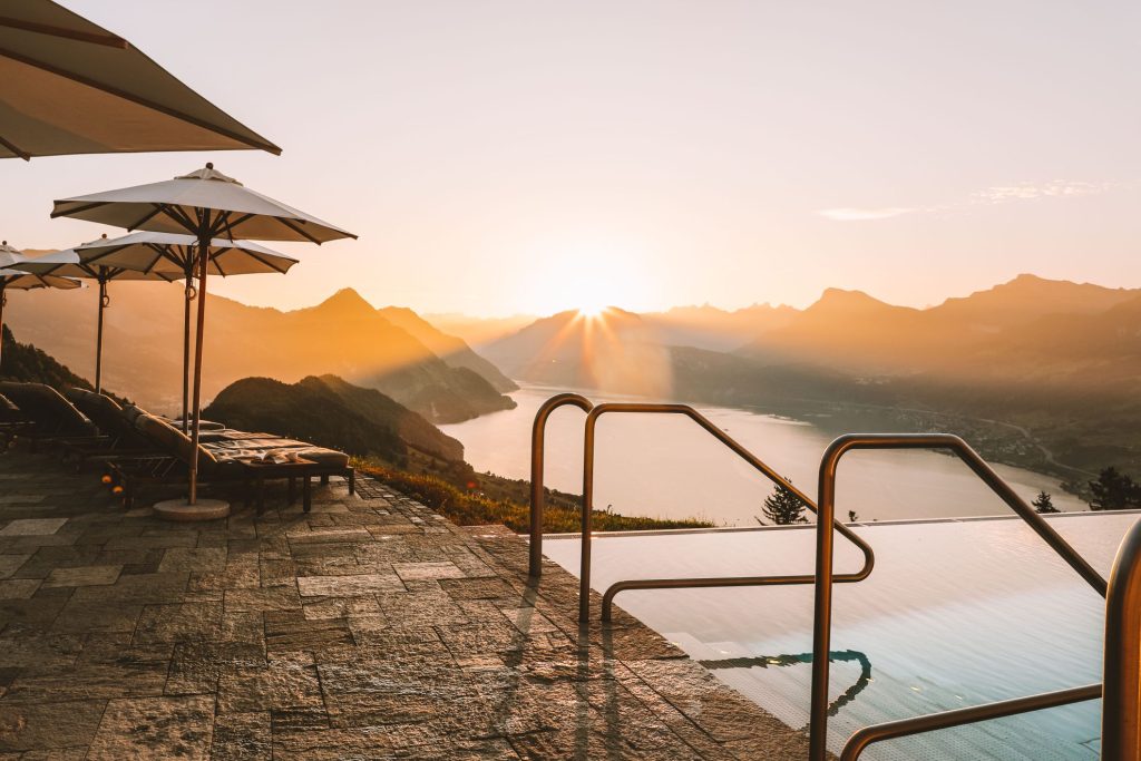 Hotel pool overlooking the mountains, with space for a long afternoon of reading