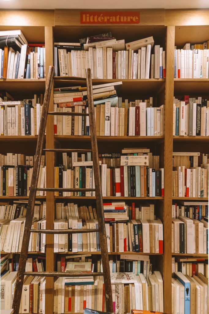 Traditional bookshop with floor-to-ceiling bookshelves and a rolling library ladder